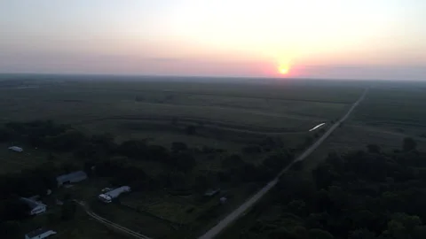 Aerial View of Country Crossroads at Sunset in Summer Pastures Stock Footage 136472053
