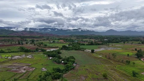 Aerial View of Countryside Fields and Misty Mountains After Rain Stock Footage 310513702
