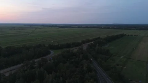 Aerial view of countryside fields and forest at dusk near Bremen Germany 動画素材 336858352
