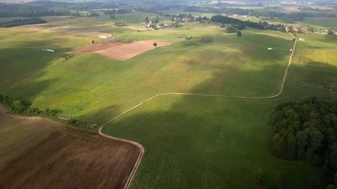 Aerial View of Countryside Fields Meadows and Forests at Sunrise Stock Footage 94884486