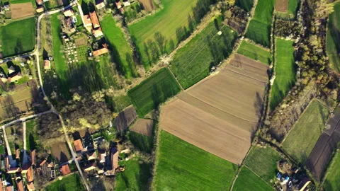 Aerial view of a countryside with patchwork of agricultural fields Stock Footage 262747697