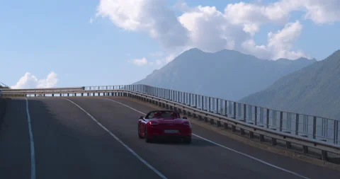 Aerial View Of Couple Driving Red Coverable Sports Car Down Road At Dusk. Part 1 Video stock 159665341