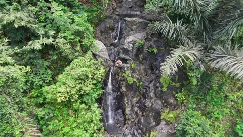 Aerial view of couple. Gembleng waterfall in Bali, Indonesia Stock Footage 316194471