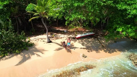 Aerial view of couple spending time at the beach Stock Footage 233461359