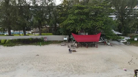Aerial view of couple standing on beach in Penang Stock Footage 150110963
