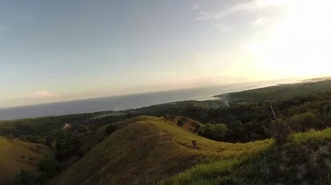 Aerial View of couple walking down the hill Видео 50076195