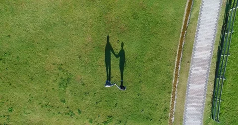 Aerial view of couple walking Stock Footage 89189214