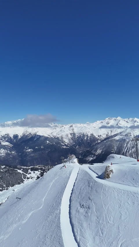 Aerial view of Courchevel ski resort slopes by winter Stock Footage 334375006