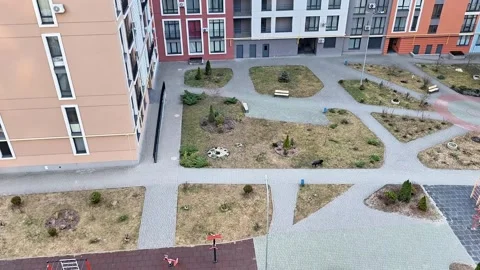 Aerial View of Courtyard with Pathways, Benches, and Playground Stock Footage 331375689