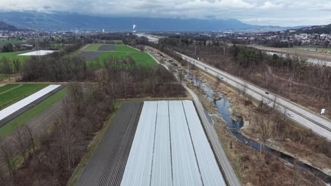 Aerial view of covered agricultural fields with rural paths in winter 스톡 동영상 329933206