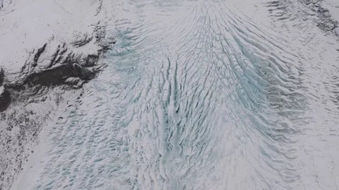 Aerial view of cracked glacier ice surface with deep crevasses in winter mo.. Stock Footage 337380819