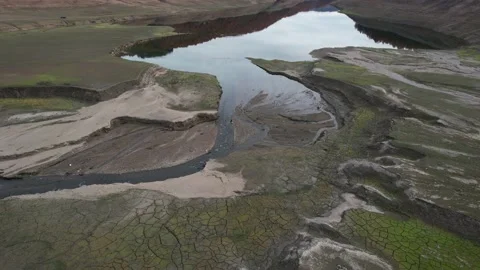 Aerial view of cracks in the ground on a dried up lake surface. Stock Footage 167317639