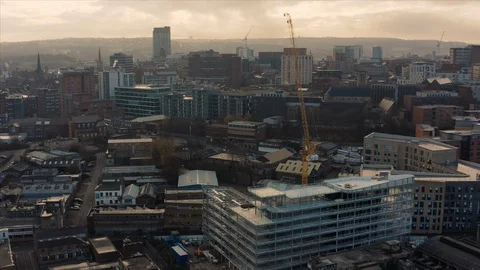 Aerial view of crane and construction site around Sheffield City South Yorkshire Stock Footage 120648481