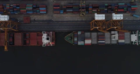 Aerial view crane and container shipping with boat in city port Stock Footage 104333590