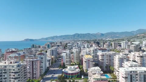 Aerial View: Crane assembly in progress as the operator navigates ladders and Vídeo Stock 296021900