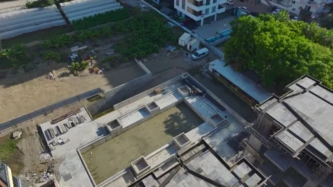 Aerial View: Crane assembly in progress as the operator mounts components and Stock Footage 296026124