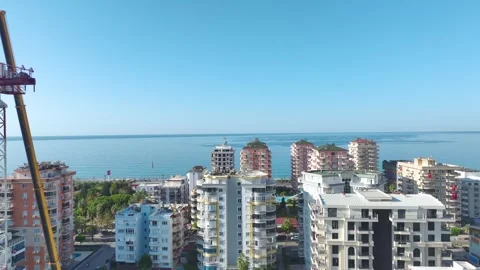 Aerial View: Crane assembly progresses as the operator works confidently Vídeo Stock 296025849