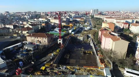 Aerial View of a Crane Carrying Construction Material in a Subway Construction Stock Footage 60765641