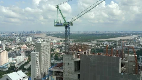 Aerial view of crane on the construction site of skyscraper in downtown Bangkok. Stock Footage 279614873