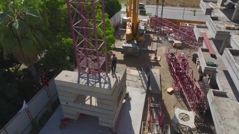 Aerial View: Crane installation is in progress with workers and engineers Stock-Footage 296019129