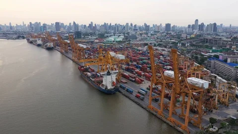 Aerial view of crane loading container box into boat in Bangkok Stock Footage 128252845
