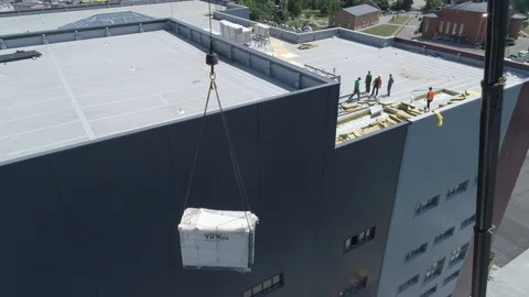 Aerial view. Crane manipulator on construction site lifts the load. 4K 스톡 동영상 112639464