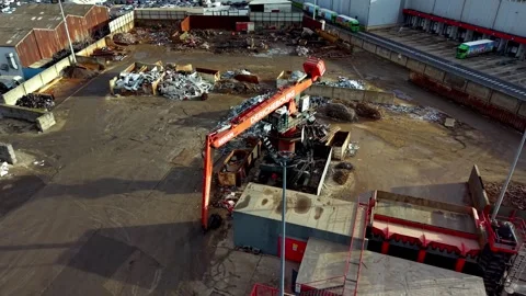Aerial view of crane operating in metal recycling plant Stock Footage 334550003