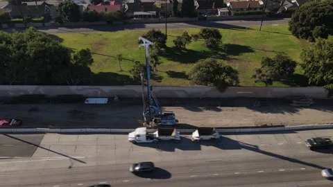 Aerial view of crane at work during construction on California's 405 freeway. Stock-Footage 164084389