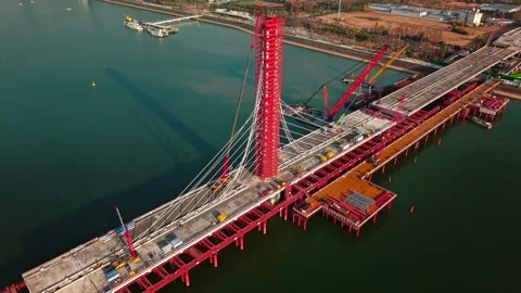 Aerial view of cranes and construction equipment are working to dismantle an old Stock Footage 335643751