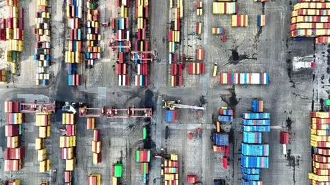 Aerial view of cranes and counters loading in port Stock Footage 241795639