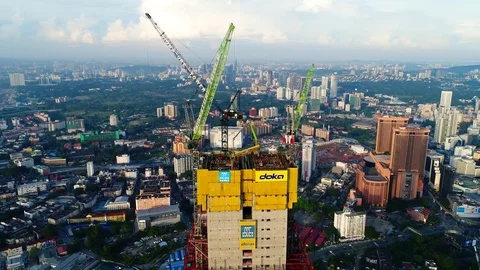 Aerial view. Cranes at the top of under construction building. Видео 81622649