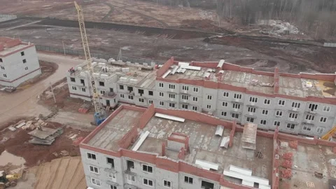 Aerial view of cranes working on a large contruction site Stock Footage 130558096