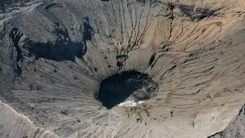 Aerial view into the crater of an active vulcano Stock Footage 146549655