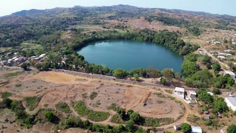 Aerial view of crater lake Lac Djabala and Lac Ampombilava. Nosy Be, Madagascar. Stock Footage 300367053