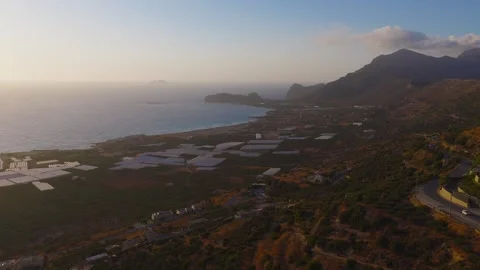 Aerial View of Crete Coastline, Fields, and Mountains at Sunset Stock Footage 315082219