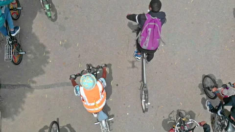 Aerial view of a crew of bicycle spinners riding their bikes Stock Footage 239454477