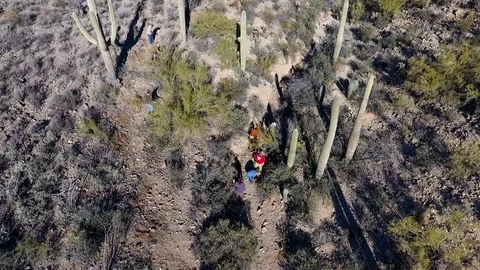 Aerial view of a crew building a trail in the desert Stock Footage 71940384