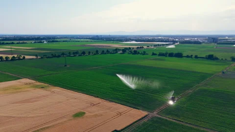 Aerial View of Crop Irrigation System Spraying Water Over  Agricultural Fields 動画素材 338350080