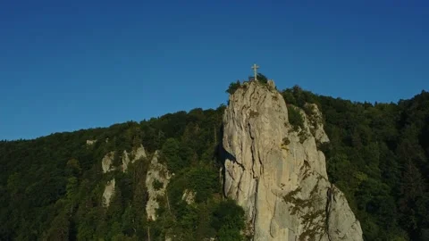 Aerial view of cross on cliff top, dramatic landscape and spiritual symbol Stock Footage 201594616