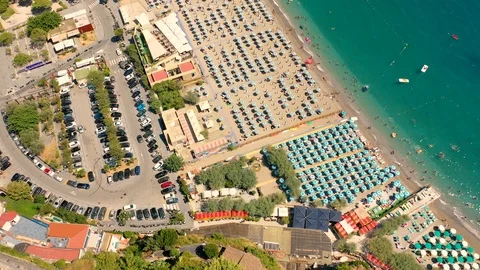 Aerial view of crowded beach full of umbrellas during the day. Stock Footage 126209244