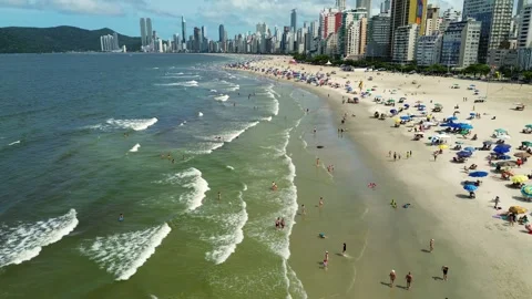 Aerial view of a crowded beach with many umbrellas in Balneário Camboriú, Brazil Stock Footage 329077884