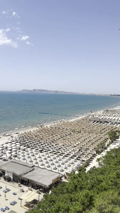 Aerial View of Crowded Beach Resort with Parasols in Golem Albania Vídeo Stock 343391649