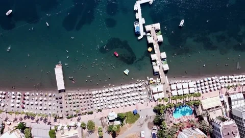 Aerial view of a crowded beach with umbrellas, Stock Footage 203833397