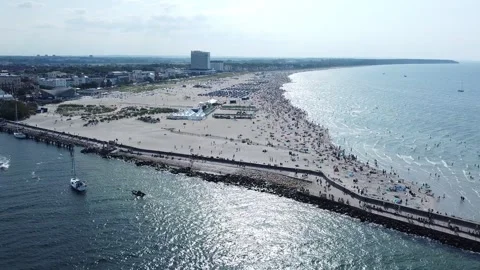 Aerial view of crowded beach of Warnemunde / Rostock during Hansesail 2022 Stock Footage 221416298