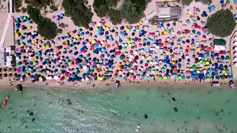 Aerial view of the crowded Torre Lapillo beach in Salento, Puglia Stock Footage 341684174