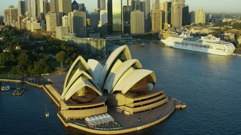 Aerial view of a Cruise Ship moored by Sydney Opera House Australia Stock Footage