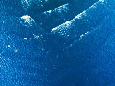 Aerial View of a Crystal clear sea water texture. View from above Natural blu Stock Photos