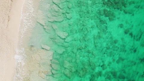 Aerial view of crystal clear turquoise sea and sandy beach in Greece Stock-Footage 337616747