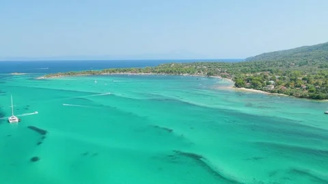 Aerial view of the crystal-clear turquoise waters and coastline of Vourvourou Stock Footage 346702811