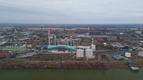 Aerial view of Csepel industrial complex with chimneys beside residential blocks Stock Footage 336468108